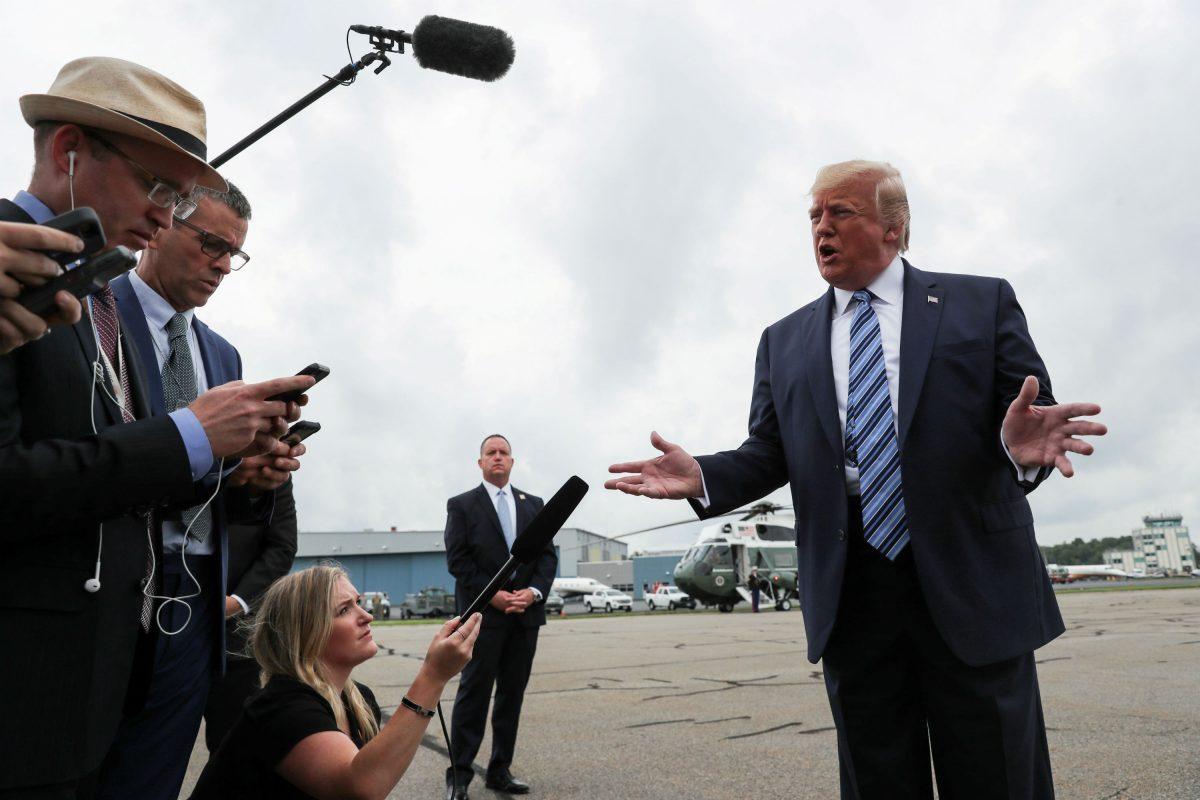 President Donald Trump talks to reporters prior to boarding Air Force One in Morristown, New Jersey, on Aug. 13, 2019. (Reuters/Jonathan Ernst/File Photo)