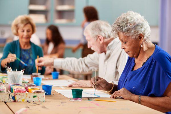 Group Of Retired Seniors Attending Art Class In Community Centre. (Shutterstock)
