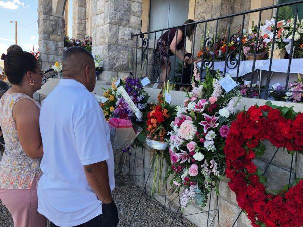 Mourners deliver flowers for the funeral of Margie Reckard, 63, who was killed by a gunman in a mass shooting earlier in the month, in El Paso Texas on Aug. 16, 2019. (Russell Contreras/AP Photo)