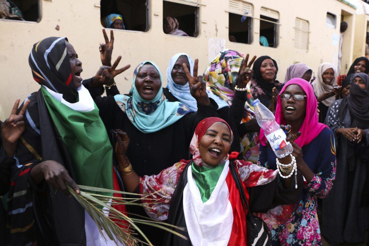 Sudanese pro-democracy supporters celebrate a final power-sharing agreement with the ruling military council on Aug 17, 2019, in the capital, Khartoum. The deal paved the way for a transition to civilian-led government following the overthrow of President Omar al-Bashir in April, 2019. (AP Photo)