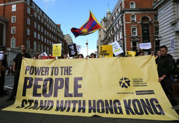 Protesters gather in central London to attend a march organised by StandwithHK and D4HK in support of Pro-democracy protests in Hong Kong, on Aug. 17, 2019. (Isabel Infantes/AFP/Getty Images)
