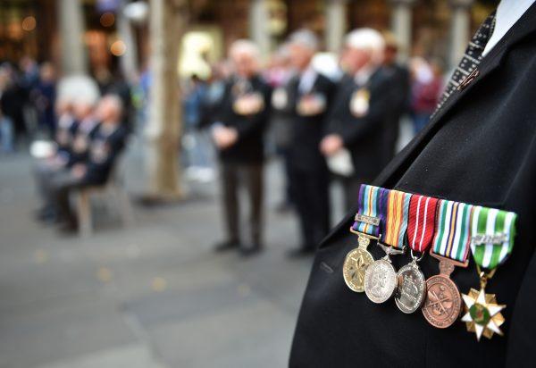 An Australian war veteran wears his medals, including a service medal from the Vietnam war (Far-L), at the 50th anniversary of the Vietnam Veterans Memorial Service in Sydney on Aug. 18, 2016. (Peter Parks/AFP/Getty Images)