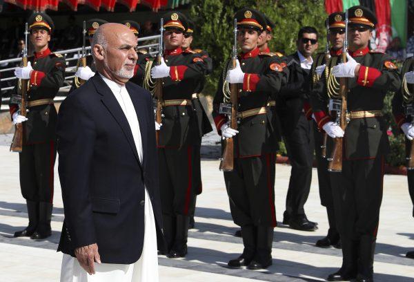 Afghan President Ashraf Ghani inspects the honor guard during Independence Day celebrations at Defense Ministry in Kabul, Afghanistan on Aug. 19, 2019. (Afghan Presidential Palace via AP)