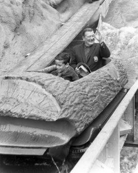 John Wayne and son Ethan on Knott's Timber Mountain Log Ride. (Courtesy of Knott's Berry Farms)