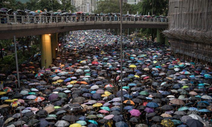 Hong Kong Protesters Plan to Form ‘Human Chain’ to Voice Their Demands