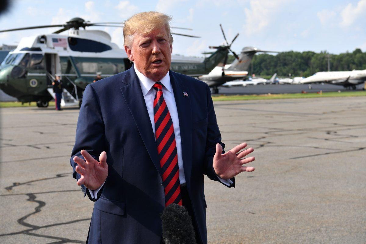 President Donald Trump speaks to reporters before boarding Air Force One in Morristown, N.J., on Aug. 18, 2019. (Nicholas Kamm/AFP/Getty Images)