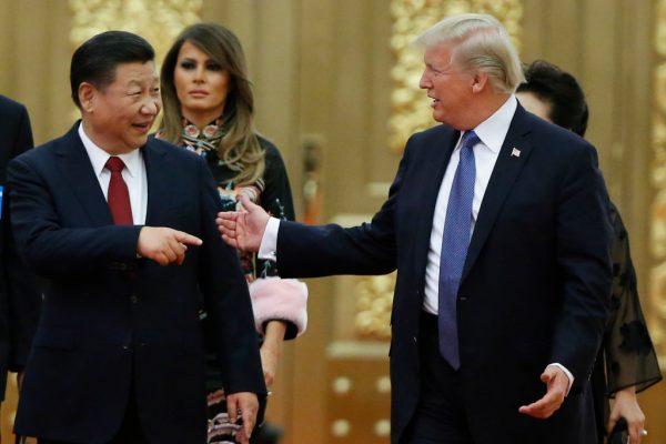 President Donald Trump and Chinese leader Xi Jinping arrive at a state dinner at the Great Hall of the People in Beijing on Nov. 9, 2017. (Thomas Peter-Pool/Getty Images)