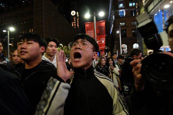 Pro-China supporters chant slogans as supporters of Hong Kong pro-democracy protesters gather during a demonstration at Martin Place in Sydney, Australia, on Aug. 16, 2019. (Saeed Khan/AFP/Getty Images)