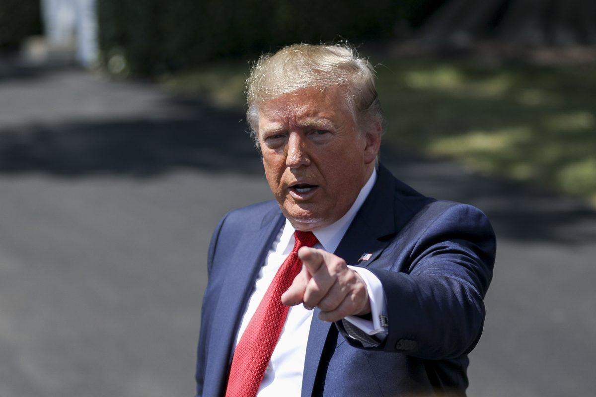 President Donald Trump speaks to media before departing the White House on Marine One en route to Kentucky to speak at the American Veterans 75th National Convention, in Washington in Aug. 21, 2019. (Charlotte Cuthbertson/The Epoch Times)