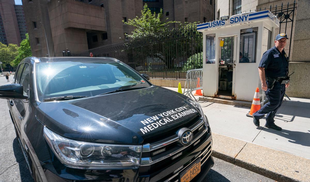 A New York Medical Examiner's car is parked outside the Metropolitan Correctional Center where financier Jeffrey Epstein was being held (DON EMMERT/AFP/Getty Images)