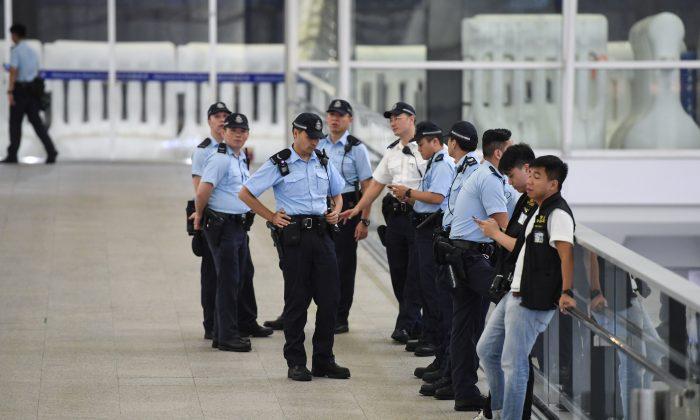 Hong Kong Police Officers Arrested for Torturing Elderly Man