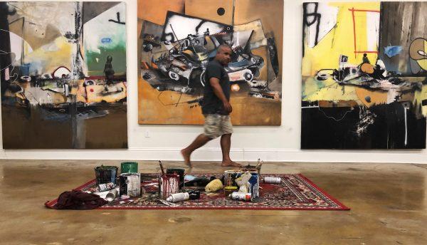 Marcus Jansen walks through his studio. (Sabrina Gruber)