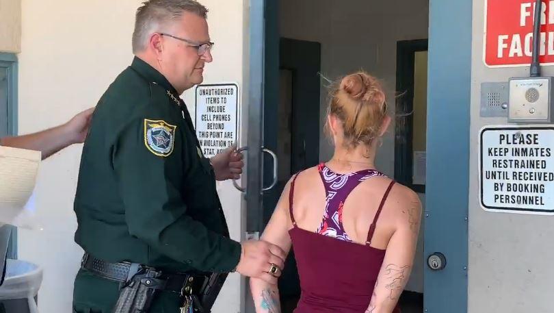Sarah Perry was identified as the woman seen in the video and arrested on a charge of felony animal abuse. (The dog was taken by authorities and examined by veterinarians. (Brevard County Sheriff's Office)