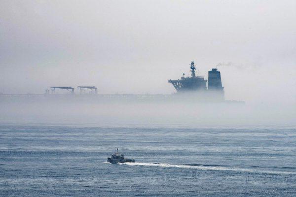 A view of the Grace 1—now known as Adrian Darya 1—supertanker is seen through the sea fog, in the British territory of Gibraltar, on Aug. 15, 2019. It was seized in July in a British Royal Navy operation off Gibraltar. (AP Photo/Marcos Moreno)