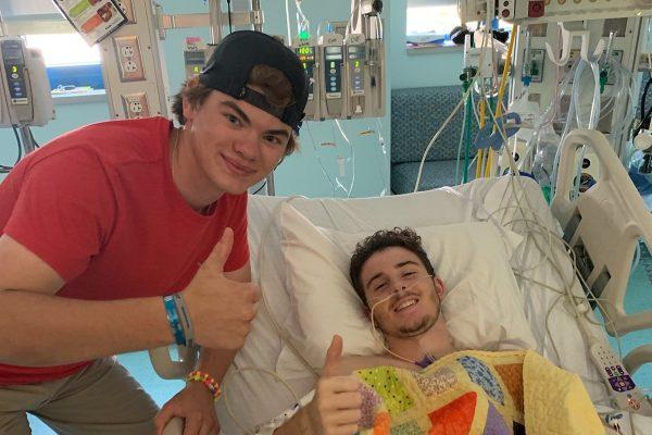 (R)-Tryston Zohfeld, 17, with a friend at the hospital. (GoFundMe)