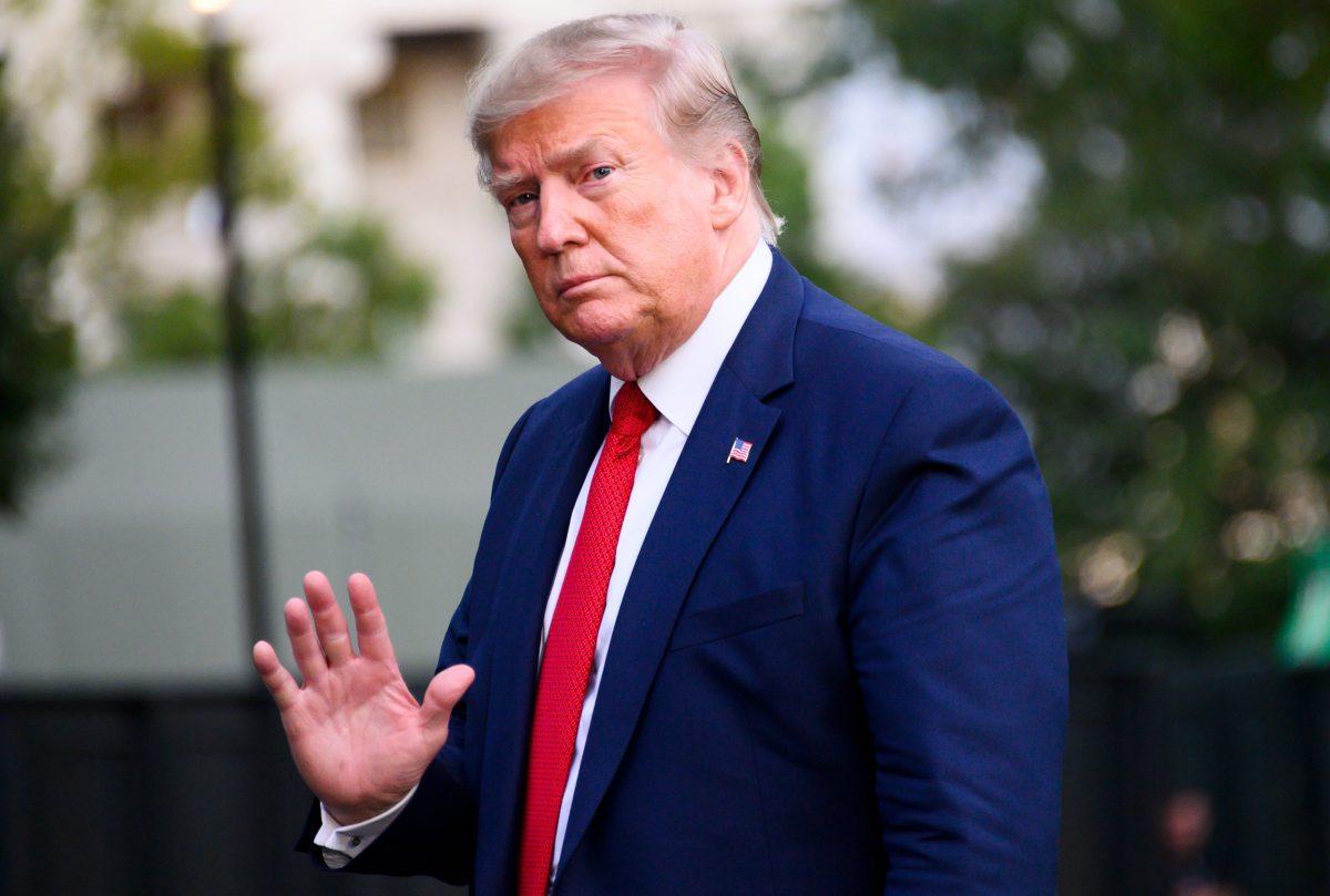 President Donald Trump waves as he arrives at the White House on Aug. 21, 2019. (Jim WatsonAFP/Getty Images)