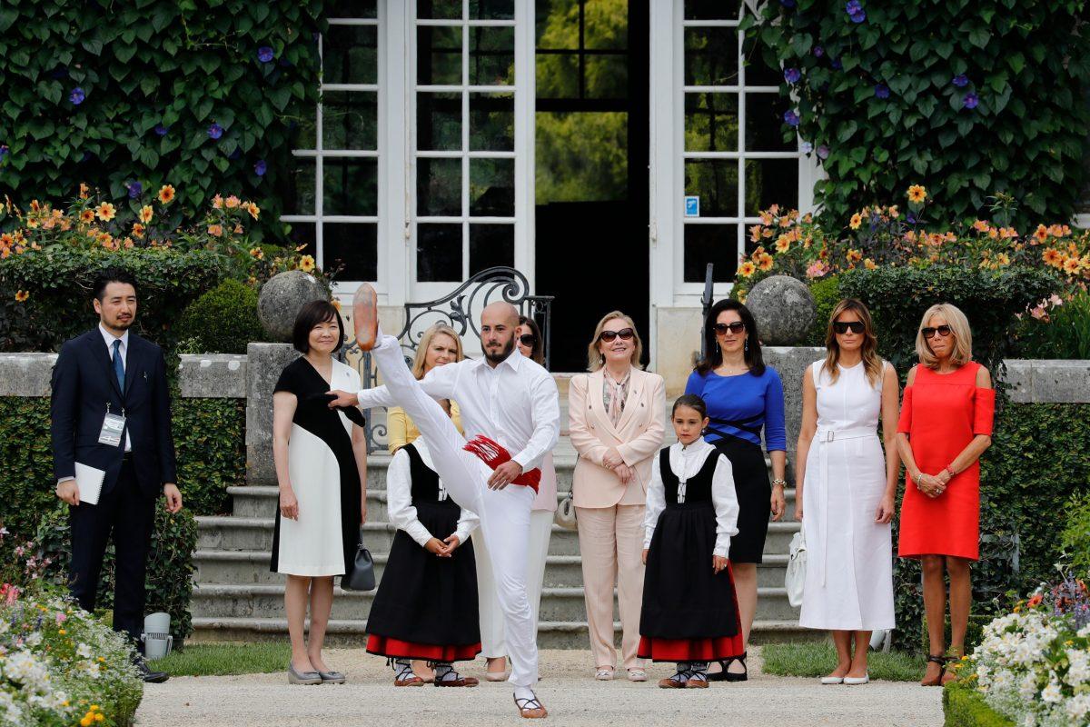(From L) Japan's Prime Minister's wife Akie Abe, European Council President's wife Malgorzata Tusk, Australia's Prime Minister's wife Jenny Morrison, Chile's First Lady Cecilia Morel, President of the World Bank Group's wife Adele Malpass, U.S. First Lady Melania Trump and wife of French President Brigitte Macron look at traditional dance performance as they arrive at the Villa Arnaga in Cambo-les-Bains during a visit on traditional Basque culture, near Biarritz as part of the G7 summit, on Aug. 25, 2019. (Thomas Samson/AFP/Getty Images)