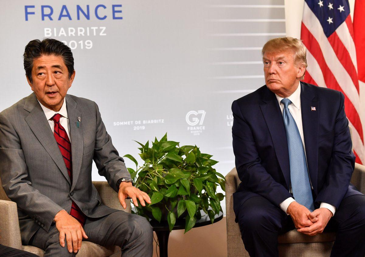 Japan's Prime Minister Shinzo Abe (L) sits with U.S. President Donald Trump during a bilateral meeting on the sidelines of the G7 summit in Biarritz, south-west France on Aug. 25, 2019. (Nicholas Kamm/AFP/Getty Images)