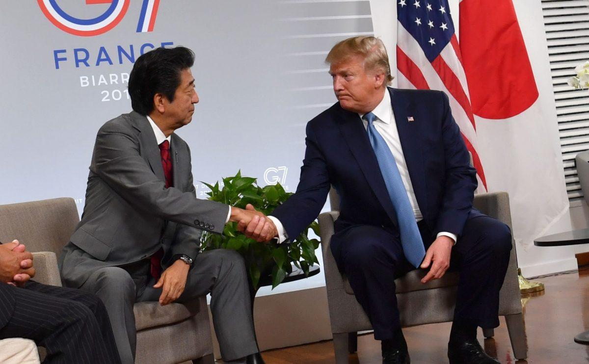 Japan's Prime Minister Shinzo Abe shakes hands with U.S. President Donald Trump during a bilateral meeting on the sidelines of the G7 summit in Biarritz, south-west France on the second day of the annual G7 Summit attended by the leaders of the world's seven richest democracies, Britain, Canada, France, Germany, Italy, Japan and the United States on Aug. 25, 2019. (Nicholas Kamm/AFP/Getty Images)