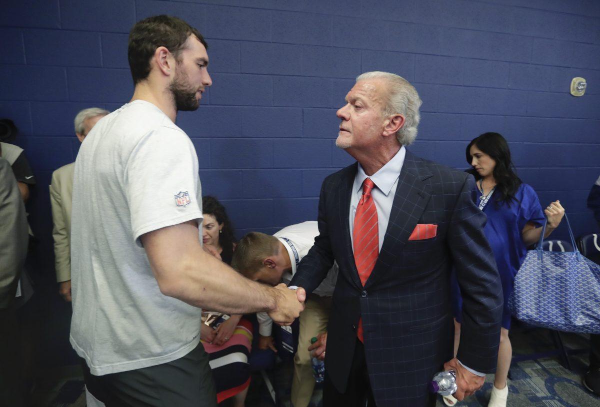 Indianapolis Colts quarterback Andrew Luck shakes hands with Indianapolis Colts owner Jim Irsay after a news conference following an NFL preseason football game against the Chicago Bears, in Indianapolis, on Aug. 24, 2019. (Michael Conroy/AP Photo)