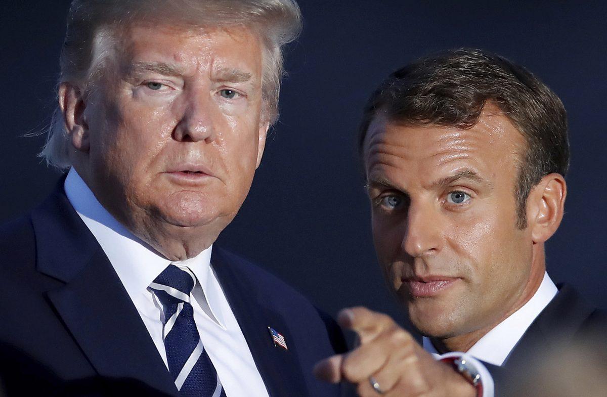 President Donald Trump talks to French President Emmanuel Macron during the G-7 family photo in Biarritz, France, on Aug. 25, 2019. (Christian Hartmann, Pool via AP)