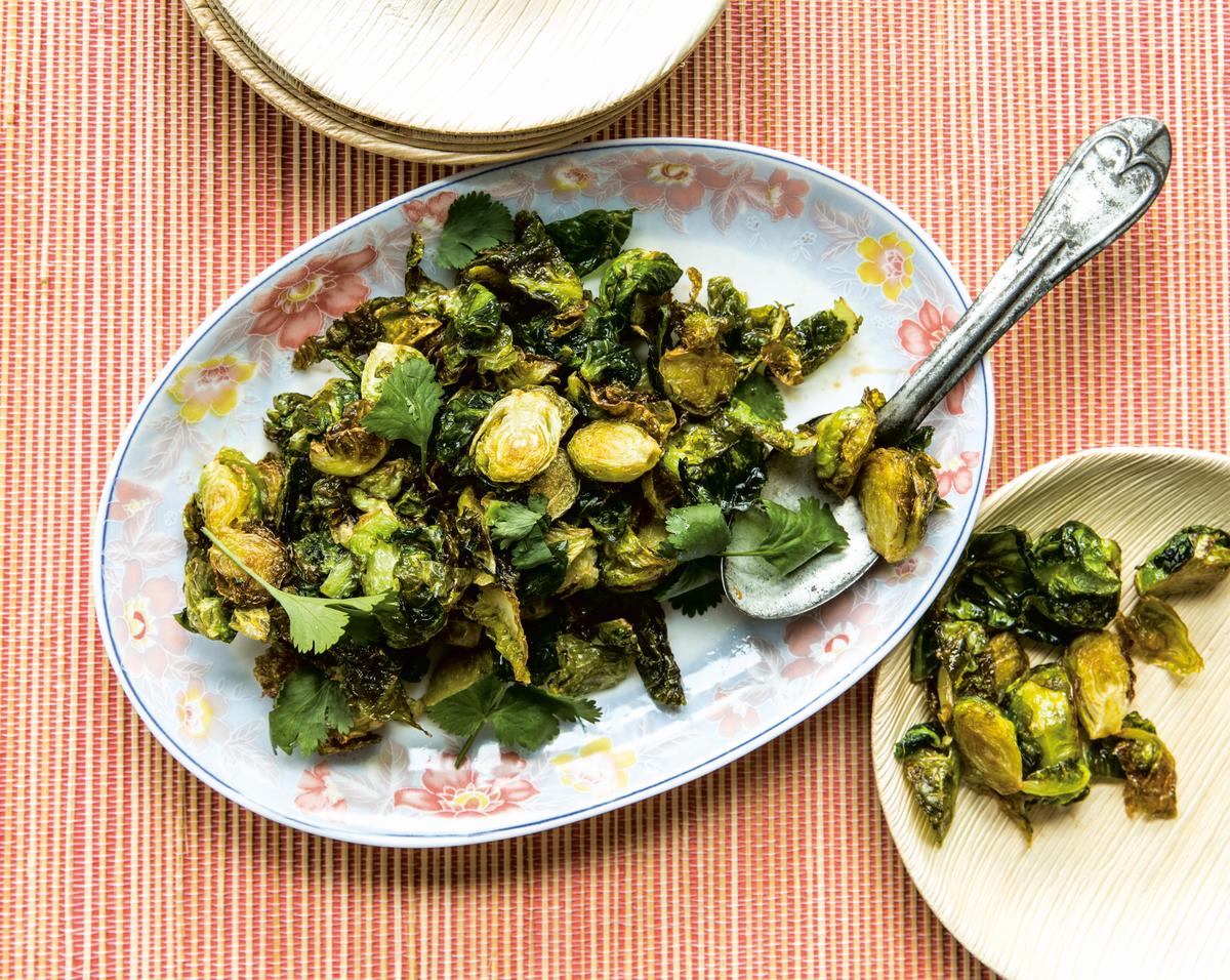 Shepherd's recipes, like these fish sauce caramel Brussels sprouts from his cookbook, "<a href="https://www.penguinrandomhouse.com/books/557129/cook-like-a-local-by-chris-shepherd-and-kaitlyn-goalen/">Cook Like a Local</a>," reflect his multicultural inspirations. (Julie Soefer)