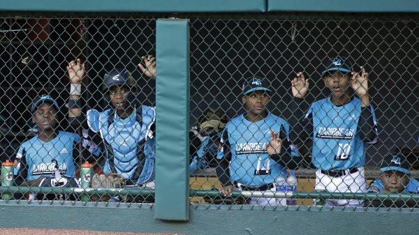 Curacao players watch the bottom of the sixth inning of the Little League World Series Championship game against River Ridge, La., in South Williamsport, Pa., on Aug. 25, 2019. (AP Photo/Gene J. Puskar)
