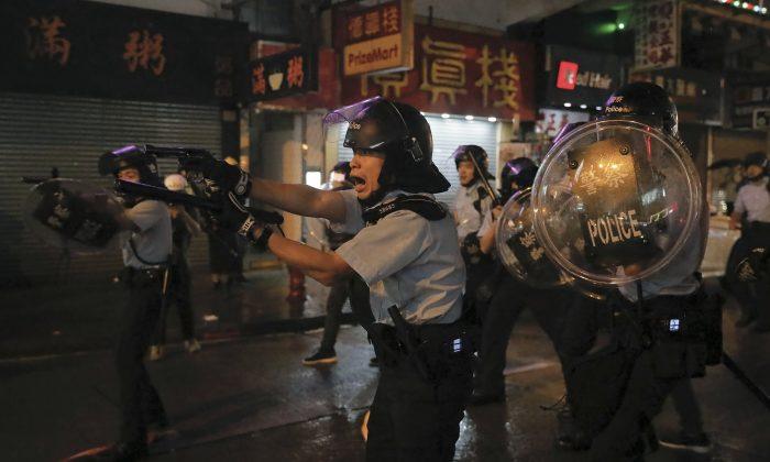 Hong Kong Police Draw Guns, Arrest 36 in Latest Protest