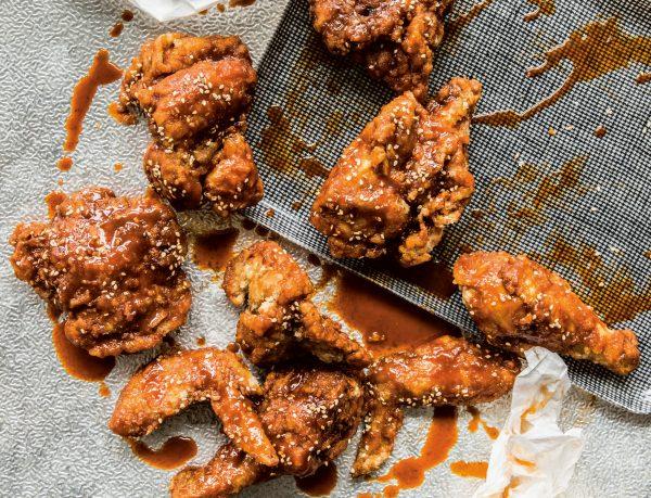 Korean fried chicken, lacquered with sweet and spicy honey and gochujang glaze, is a Korean food court classic. (Julie Soefer)