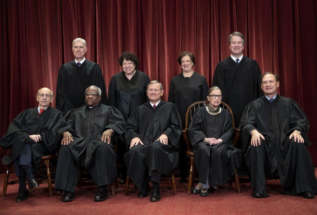 In this Nov. 30, 2018, file photo, the justices of the U.S. Supreme Court gather for a formal group portrait to include the new Associate Justice, top row, far right, at the Supreme Court Building in Washington, Friday, Nov. 30, 2018. Seated from left: Associate Justice Stephen Breyer, Associate Justice Clarence Thomas, Chief Justice of the United States John G. Roberts, Associate Justice Ruth Bader Ginsburg and Associate Justice Samuel Alito Jr. Standing behind from left: Associate Justice Neil Gorsuch, Associate Justice Sonia Sotomayor, Associate Justice Elena Kagan, and Associate Justice Brett M. Kavanaugh. (J. Scott Applewhite/AP Photo)
