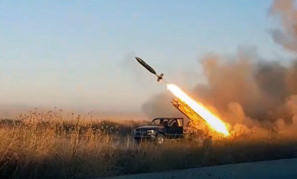 This photo provided by the Ibaa News Agency, the media arm of al-Qaida-linked Hayat Tahrir al-Sham militant group in Syria, purports to show a missile fired by the militant group against Syrian government forces position in Idlib province, Syria, Tuesday, Aug. 27, 2019. (Ibaa News Agency via AP)