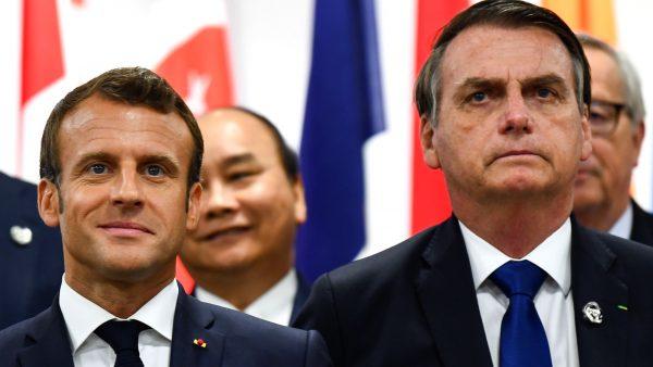 France's President Emmanuel Macron and Brazil's President Jair Bolsonaro attend an event on women's empowerment during the G20 Summit in Osaka on June 29, 2019. (Brendan Smialowski/AFP/Getty Images)