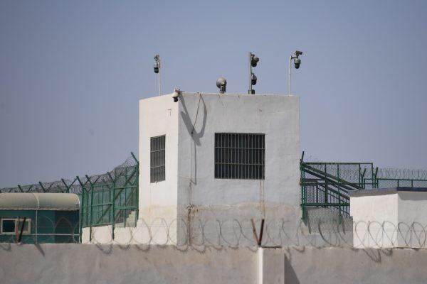 The outer wall of what's believed to be a re-education camp is equipped with several surveillance cameras in Xinjiang, China, on May 31, 2019. (Greg Baker/AFP/Getty Images)