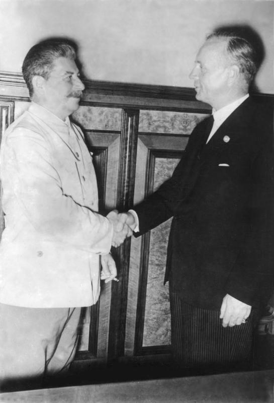 Soviet leader Joseph Stalin shakes hands with Nazi Germany's Foreign Minister Joachim von Ribbentrop after the signing of the Molotov-Ribbentrop Pact on Aug. 23, 1939. (Bundesarchiv, Bild 183-H27337 / CC-BY-SA 3.0)
