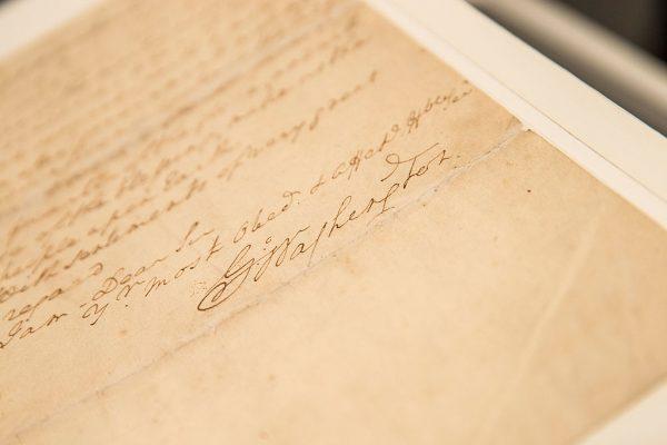 The signature of George Washington is seen on a letter he wrote regarding the United States Constitution. (Andrew Burton/Getty Images)