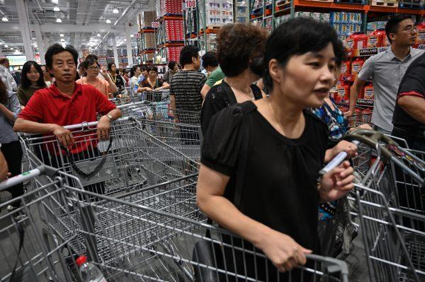Empty carts piled together as people shop in Costco in Shanghai, China on Aug. 27, 2019. (Hector Retamal/AFP/Getty Images)