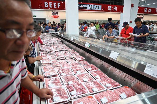 People browsing the meat section at Costco in Shanghai, China on Aug. 27, 2019. (Hector Retamal/AFP/Getty Images)