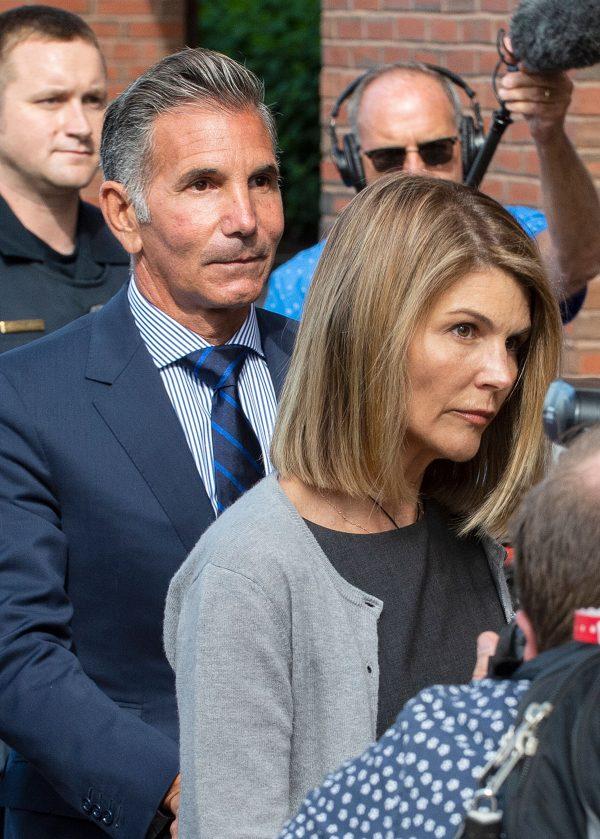 Actress Lori Loughlin and her husband Mossimo Giannulli leave the Boston Federal Courthouse after a pre-trial hearing with Magistrate Judge Kelley at the John Joseph Moakley U.S. Courthouse in Boston on Aug. 27, 2019. (Joseph Prezioso/AFP/Getty Images)