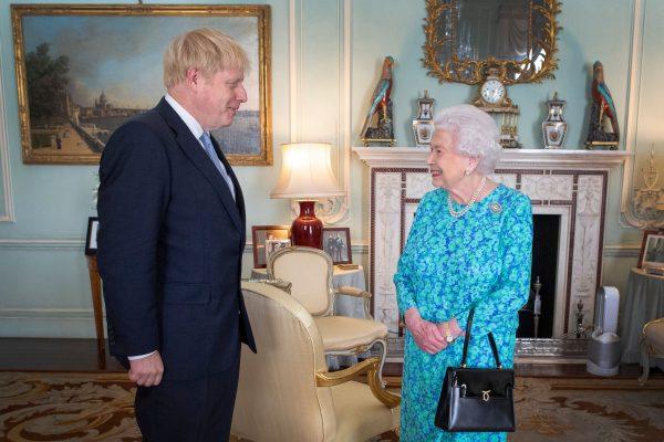 Britain's Queen Elizabeth II welcomes newly elected leader of the Conservative party, Boris Johnson during an audience in Buckingham Palace in London on July 24, 2019. (Victoria Jones/AFP/Getty Images)