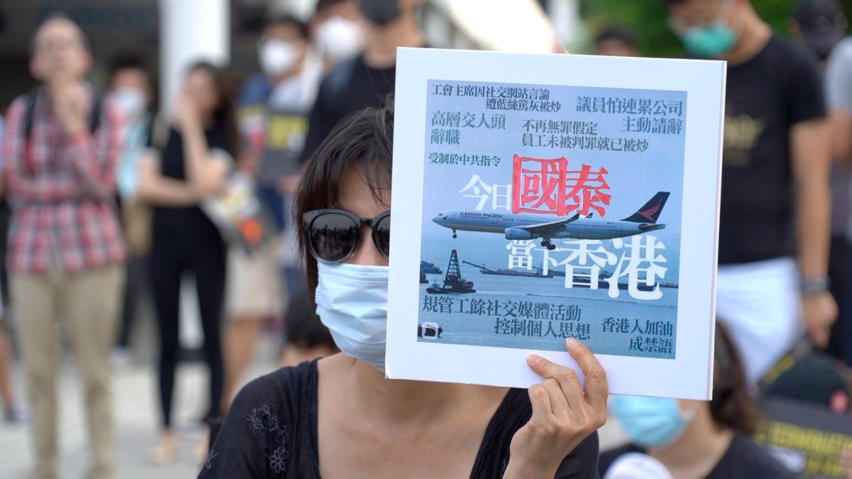 A rally was held in Hong Kong protesting Cathay Pacific's recent firings of staff over supporting protests. A large banner that read "Revoke Termination Stop Terrorizing CX Staff" was on stage in Edinburgh Place, Hong Kong on Aug. 28, 2019. (Shenghua Sung/NTD News)