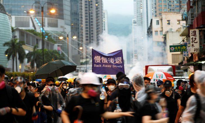 ‘Stop Terrorizing Cathay Staff,’ Hong Kong Protesters Tell Airline