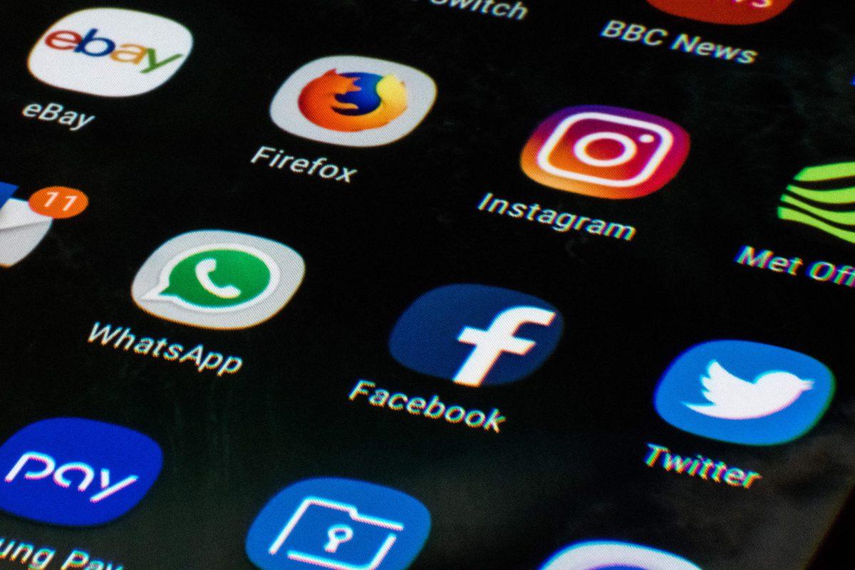 A mobile phone screen displays the icons for the social networking apps Facebook, Twitter and Instagram on March 22, 2018. (Oli Scarff/AFP/Getty Images)