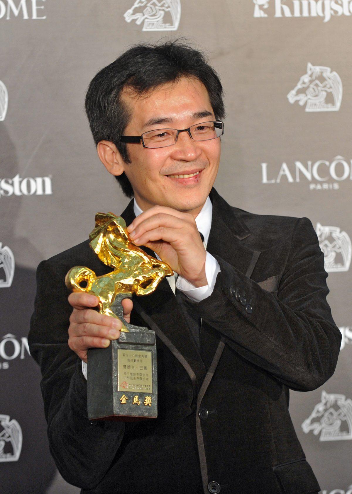 Taiwanese director Wei Te-sheng with the Golden Horse Film Award for Best Feature Film for his "Warriors of the Rainbow: Seediq Bale" on Nov. 26, 2011. (PATRICK LIN/AFP/Getty Images)