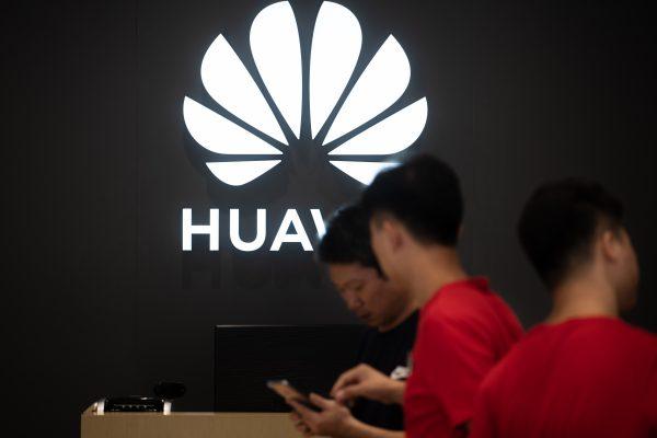Employees work at a Huawei store in Dongguan, China, on Aug. 9, 2019. (Fred DufourAFP/Getty Images)