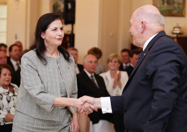 Concetta Fierravanti-Wells is congratulated by Governor-General Sir Peter Cosgrove in Canberra, Australia on Sept. 21, 2015. (Stefan Postles - Pool/Getty Images)