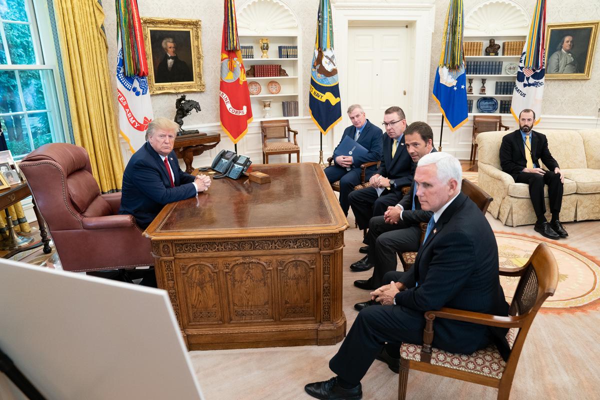 President Donald J. Trump, joined by Vice President Mike Pence, receives a briefing on Hurricane Dorian as it approaches the U.S. mainland in the Oval Office of the White House on Aug. 29, 2019. (Official White House Photo by Shealah Craighead)