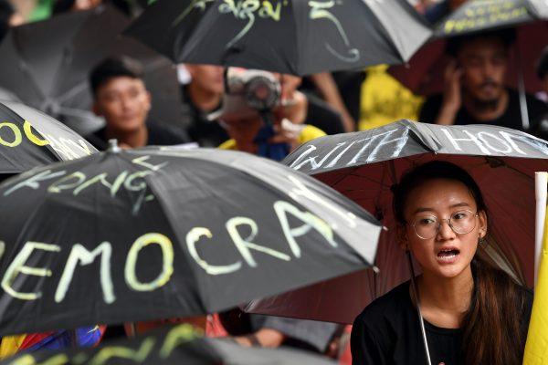 Tibetan Youth Congress (TYC) activists shout slogans as they take part in a protest in support of Hong Kong pro-democracy protesters in New Delhi on Aug. 30, 2019. (Prakash Singh/AFP/Getty Images)