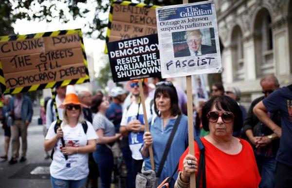 Anti-Brexit protestors hold signs as they demonstrate at Whitehall in London, Britain, on Aug. 31, 2019. (Henry Nicholls/Reuters)