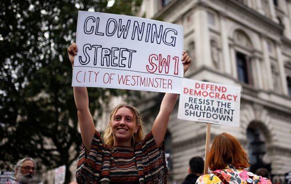 Anti-Brexit protestors hold signs as they demonstrate at Whitehall in London, Britain, on Aug. 31, 2019. (Henry Nicholls/Reuters)