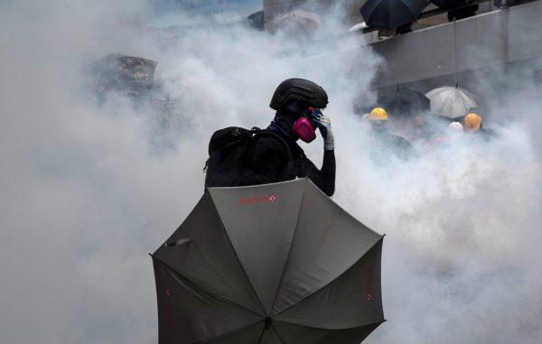 A demonstrator reacts after police fires tear gas during a protest in Hong Kong, on Aug. 31, 2019. (Danish Siddiqui/Reuters)